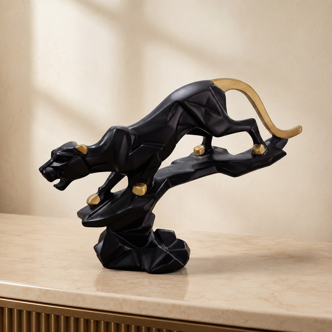 Black and gold panther sculpture on a console shelf