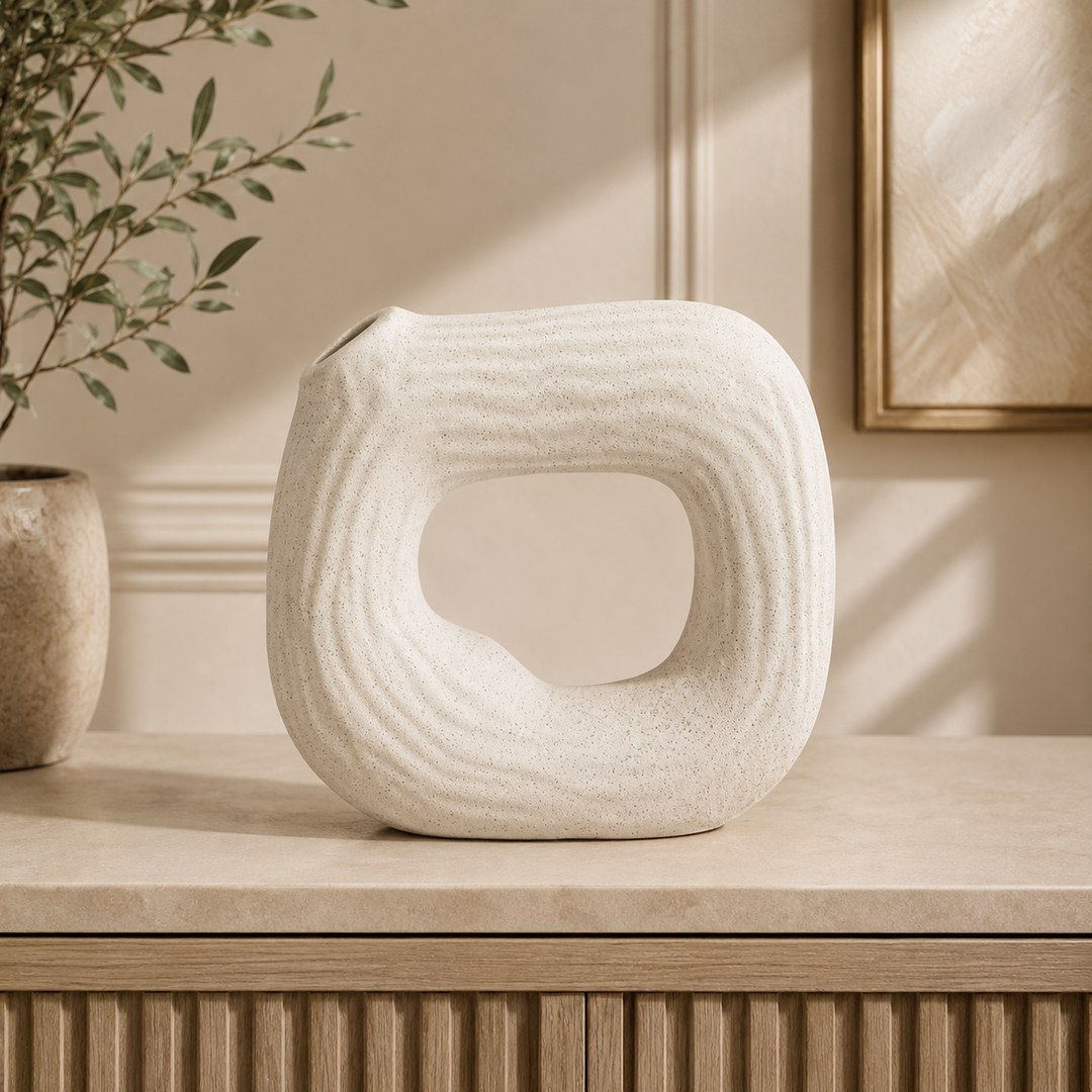 White speckled round ceramic vase for a compact dining-table arrangement