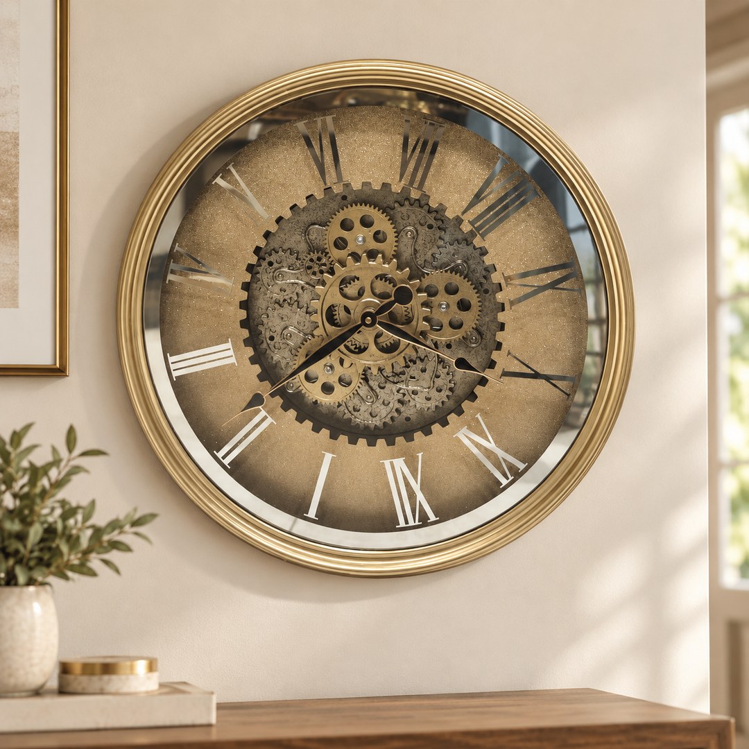 Large gold mirrored Roman gear wall clock on a light wall